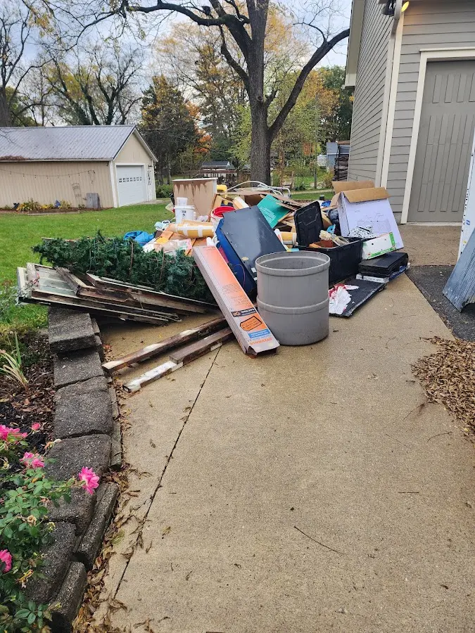 Dumpster being loaded with debris for Demolition Dumpster Rental in Hodgenville
